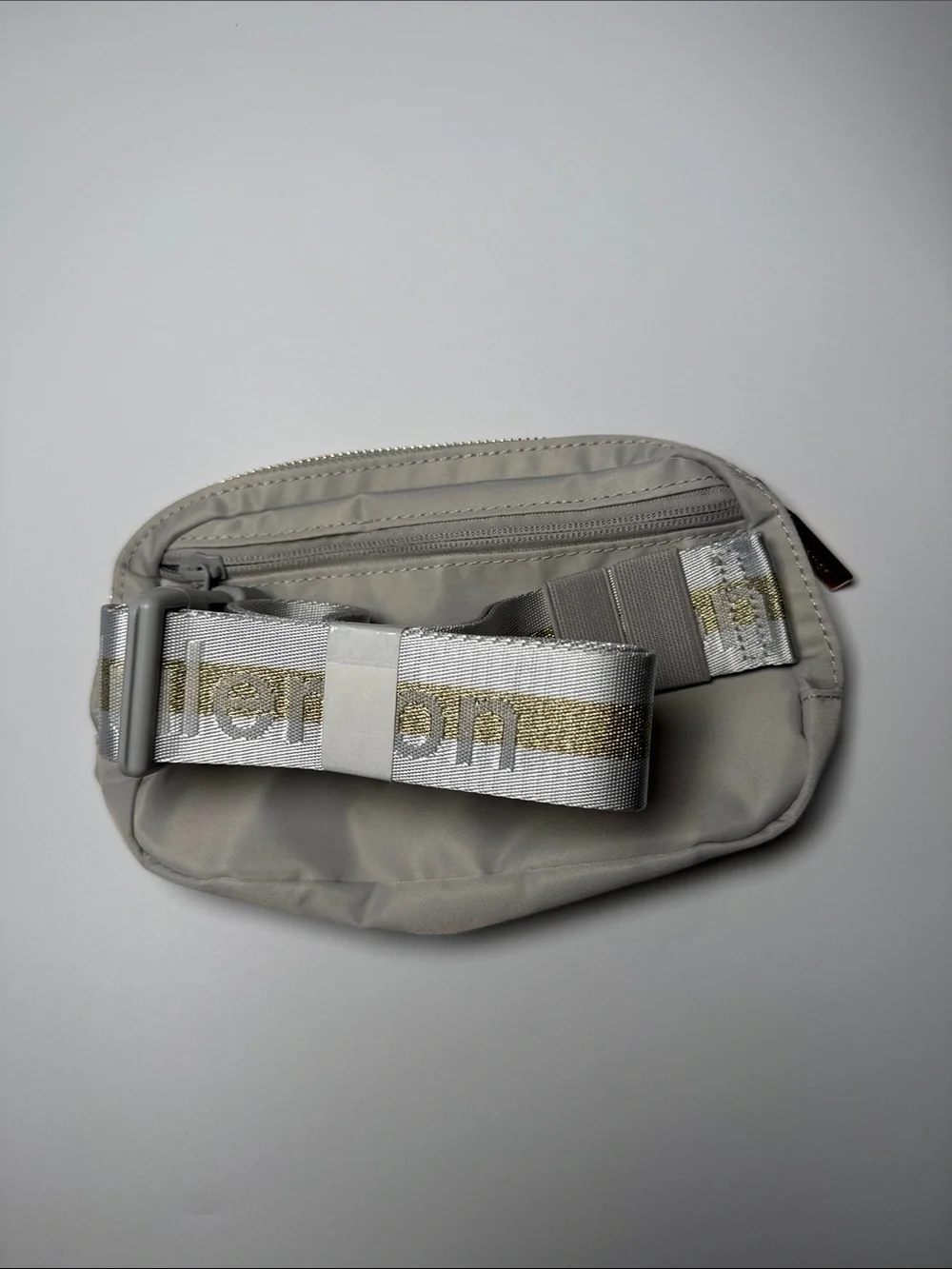 lululemon athletica Light Gray Belt Bag with White & Gold Accent Strap